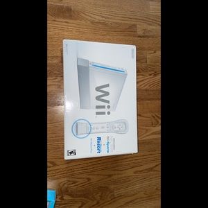 Wii console (Renewed) Comes with everything you see the games,remotes and cables